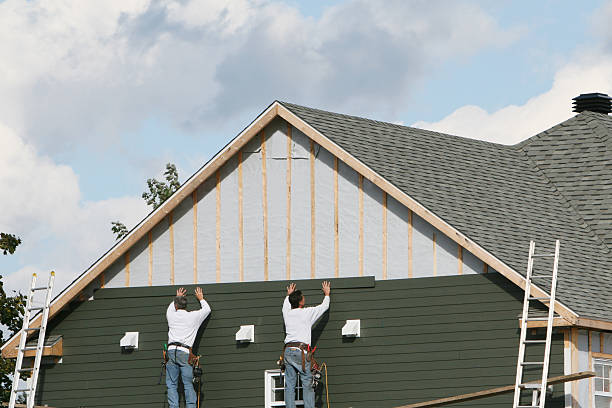 Professional Storm Damage Siding Repair technician working in Terryville, CT